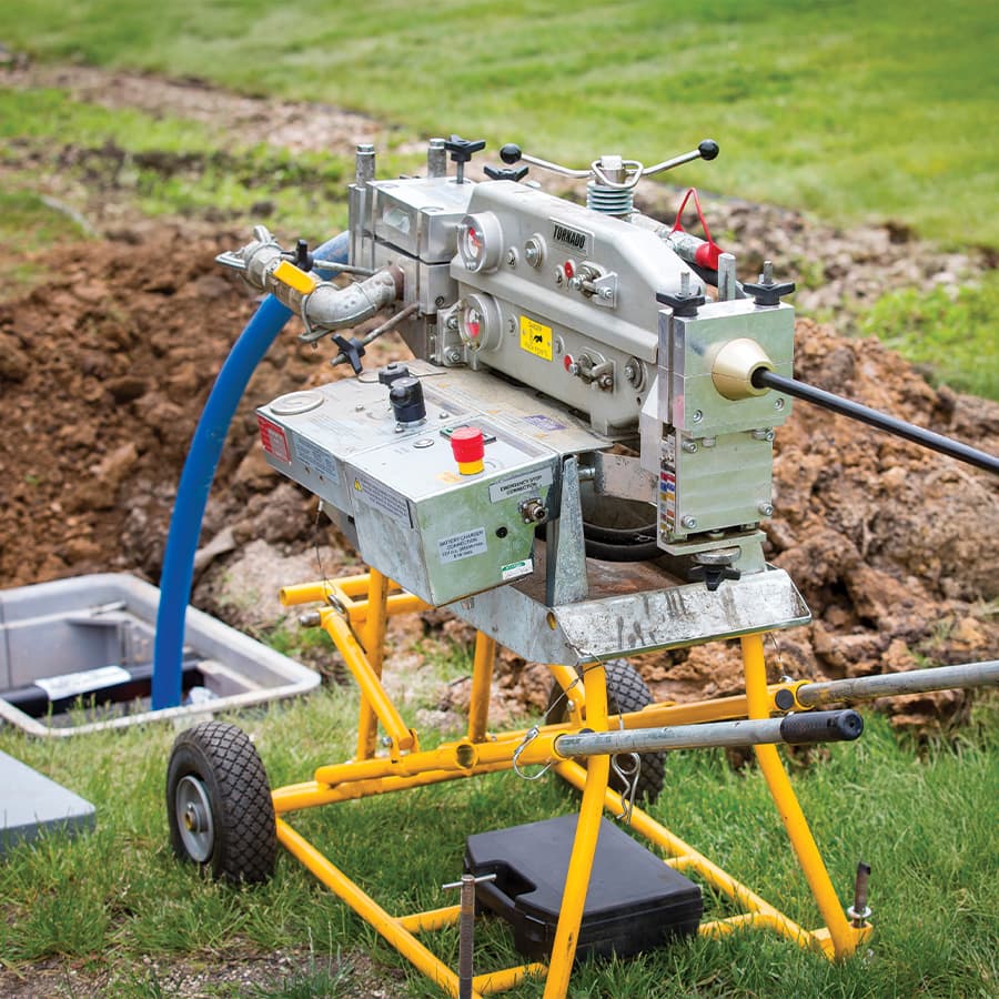 Three small plants being held by hands